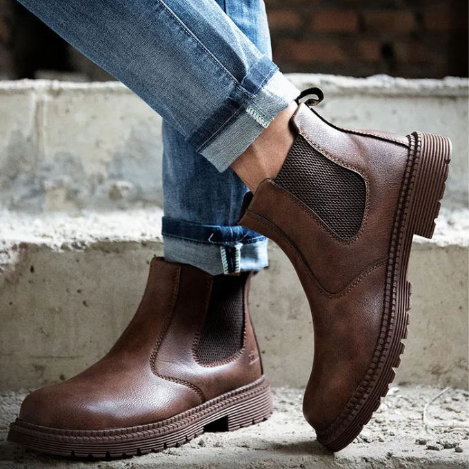 Black men's steel toe Chelsea work boots for safety and durability on the job site.