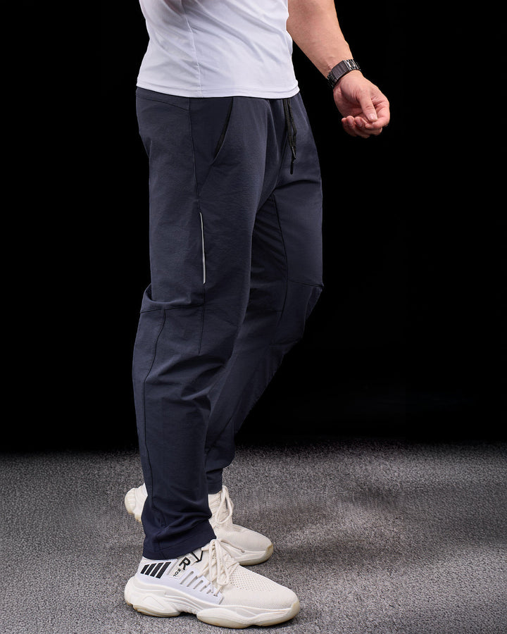 Men's essential adventure pants. Durable stretch fabric, quick-dry for hiking and travel.