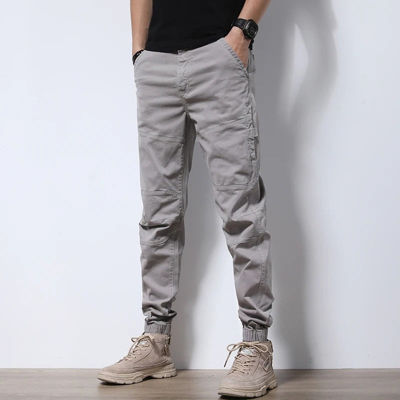 Comfortable men's cotton blend cargo joggers, reinforced for urban activewear.
