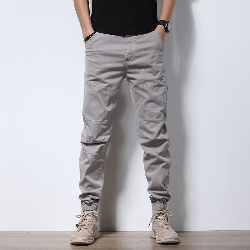 Reinforced men's athletic joggers, urban cargo pants for comfort & lasting wear.