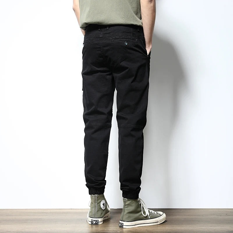 Utility men's joggers, reinforced design with cargo pockets for urban fashion.