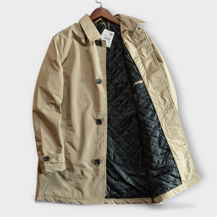 Man wearing durable weatherproof all-season coat, ideal for outdoor adventures & daily commutes.