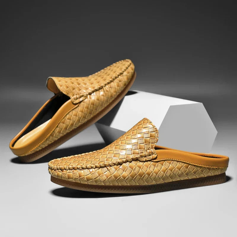 Man's feet in Durabreeze black slip-on loafers. Comfortable, casual, and stylish men's footwear for everyday.