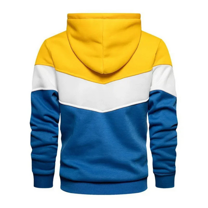 Man in men's colorblock hoodie, showcasing relaxed casual style & comfort.