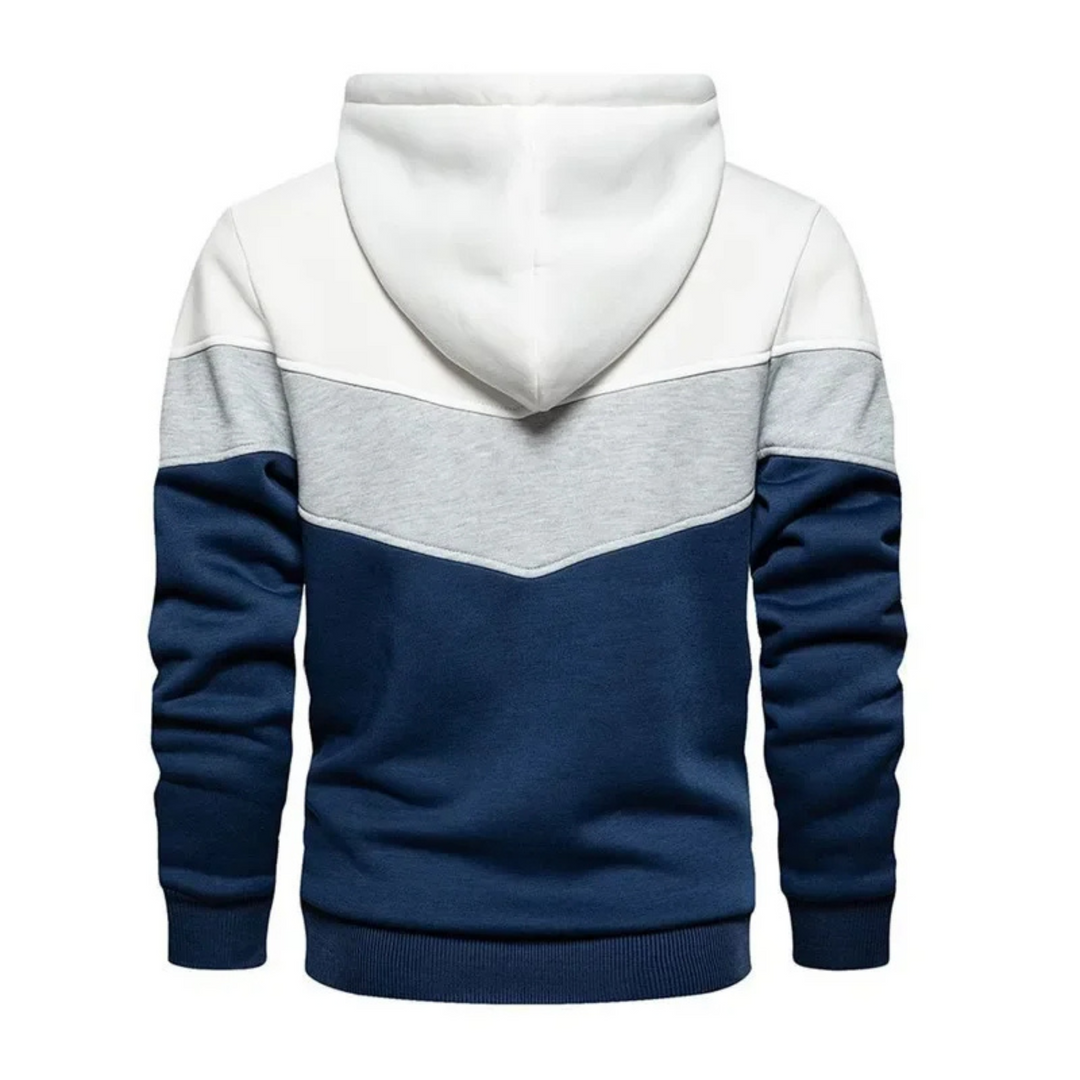 Men's colorblock pullover hoodie displayed on hanger, ready for athletic or casual use.