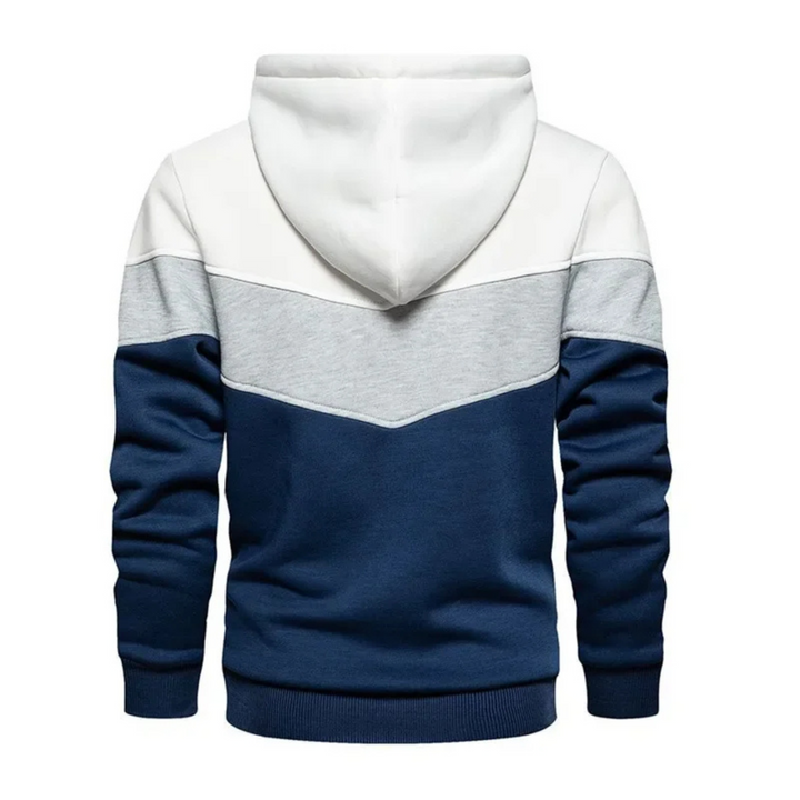 Men's colorblock pullover hoodie displayed on hanger, ready for athletic or casual use.