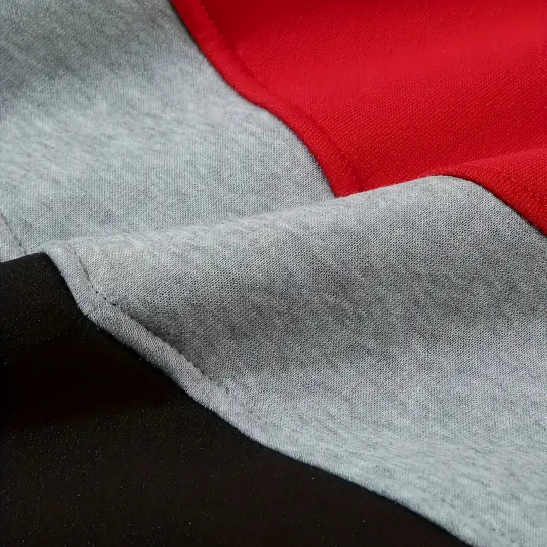 Close-up of hood on men's colorblock pullover, offering warmth & dynamic design.