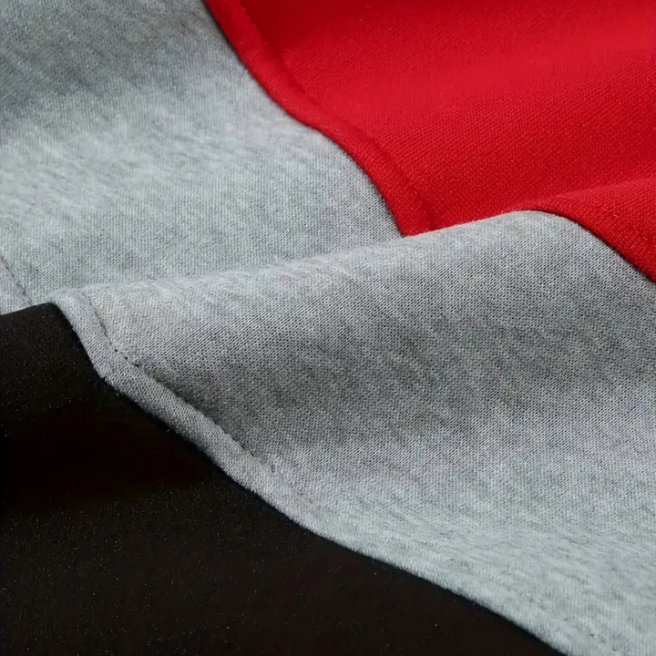 Close-up of hood on men's colorblock pullover, offering warmth & dynamic design.