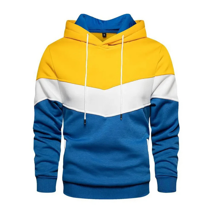 Man wearing dynamic colorblock pullover hoodie during outdoor activity, athletic fit.