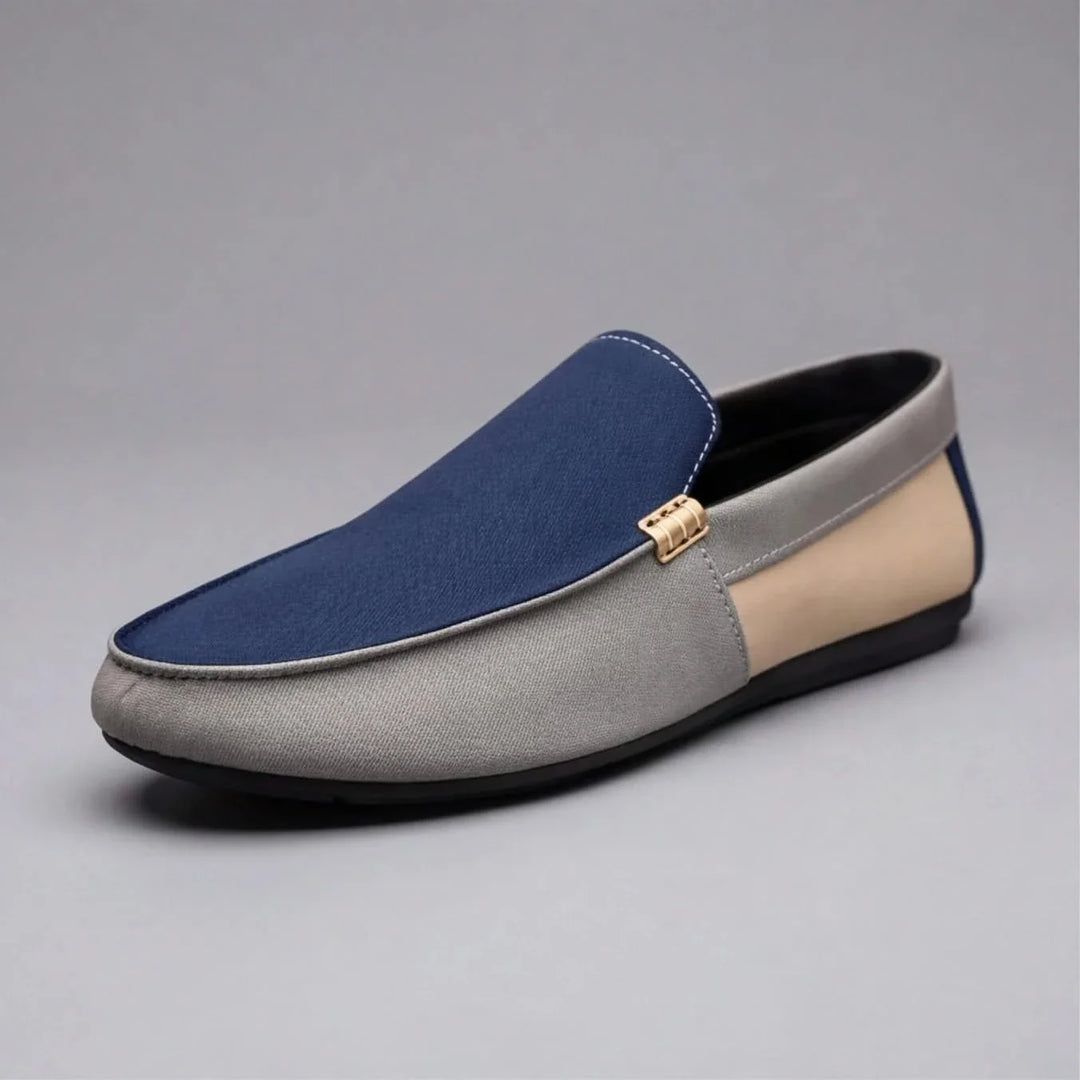 Men's effortless blue slip-on loafers with patchwork design, offering all-day comfort & casual style.