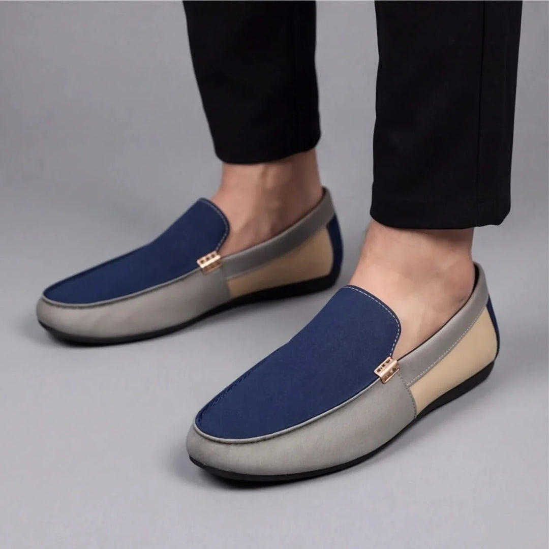 Stylish men's beige slip-on loafers with unique patchwork details, ideal for casual spring footwear.