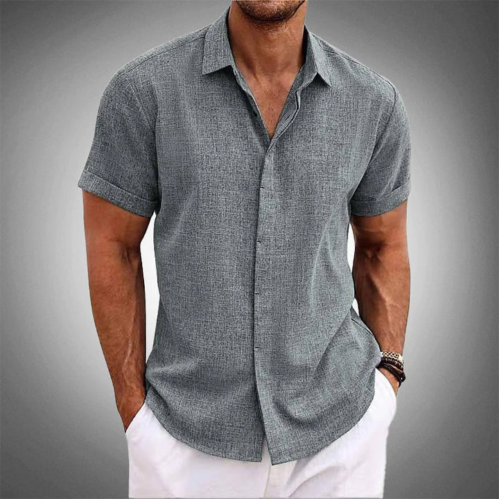 Comfortable men's gray short-sleeve shirt. Wrinkle-resistant & versatile for everyday warm weather style.