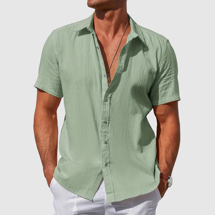 Lightweight men's summer comfort shirt. Short-sleeve, breathable, relaxed fit for cool weather and casual style.