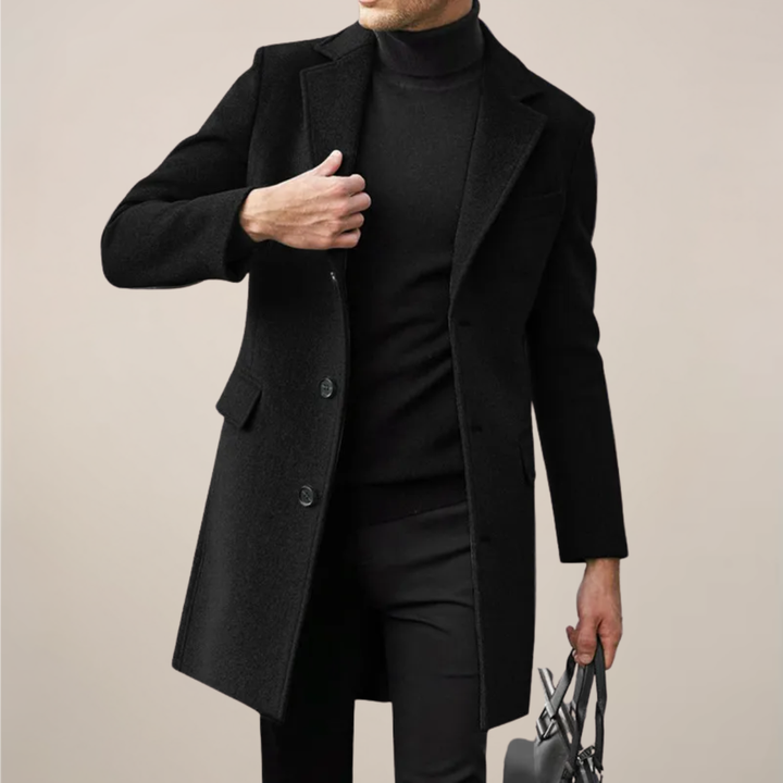 Men's elegant black single-breasted long overcoat. Tailored winter outerwear for formal or smart casual fashion.
