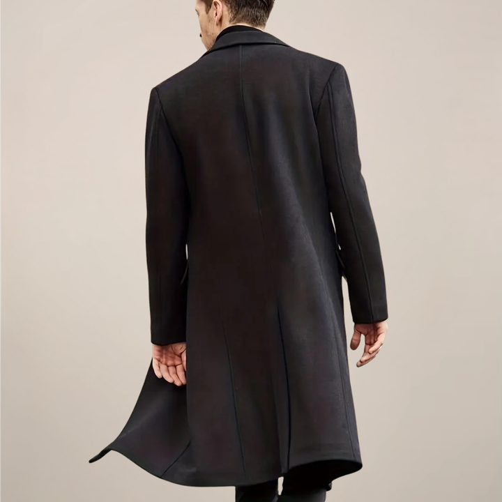 Tailored men's black long overcoat. Single-breasted design, perfect for sophisticated winter fashion and formal wear.