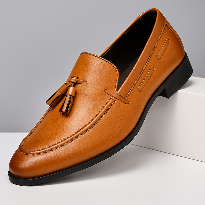 Men's elegant black slip-on tassel loafers, perfect for dress or smart casual wear.