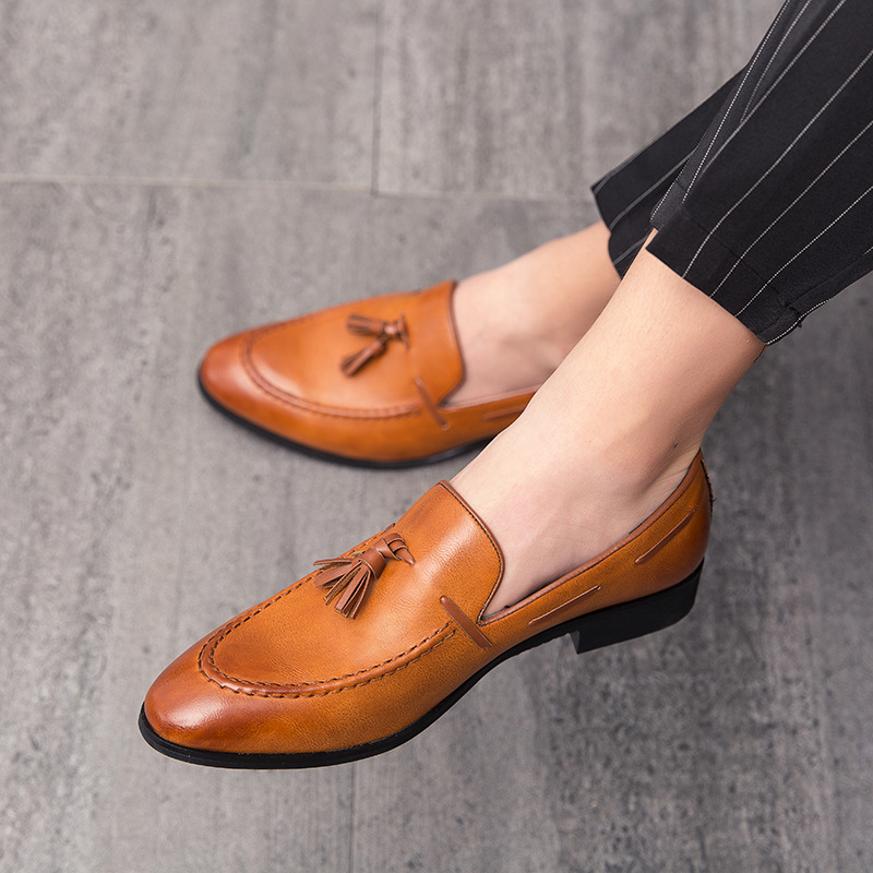 Comfortable men's brown slip-on tassel loafers, classic style for office or formal events.