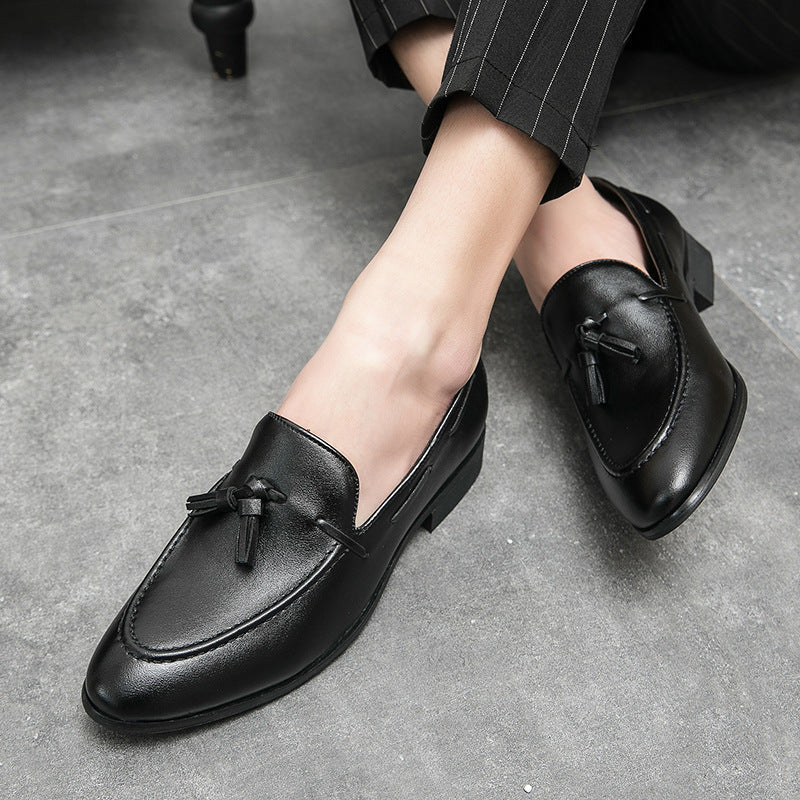 Classic men's elegant slip-on tassel loafers, essential formal and dress footwear.
