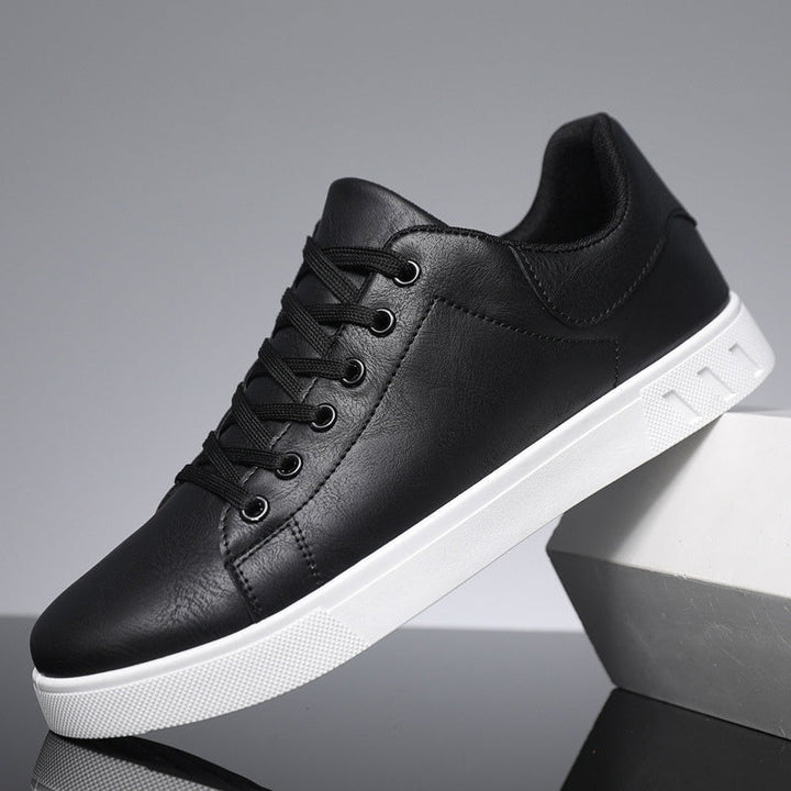 Stylish black men's sneakers, versatile for everyday fashion, comfortable walking, and casual wear.