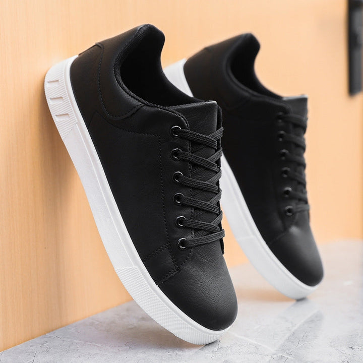 Side view of elegant men's comfort sneakers, showcasing their stylish design and suitability for everyday walking.