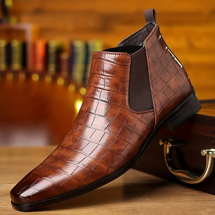 Stylish men's slip-on crocodile embossed Chelsea boots, perfect for dress or casual wear.