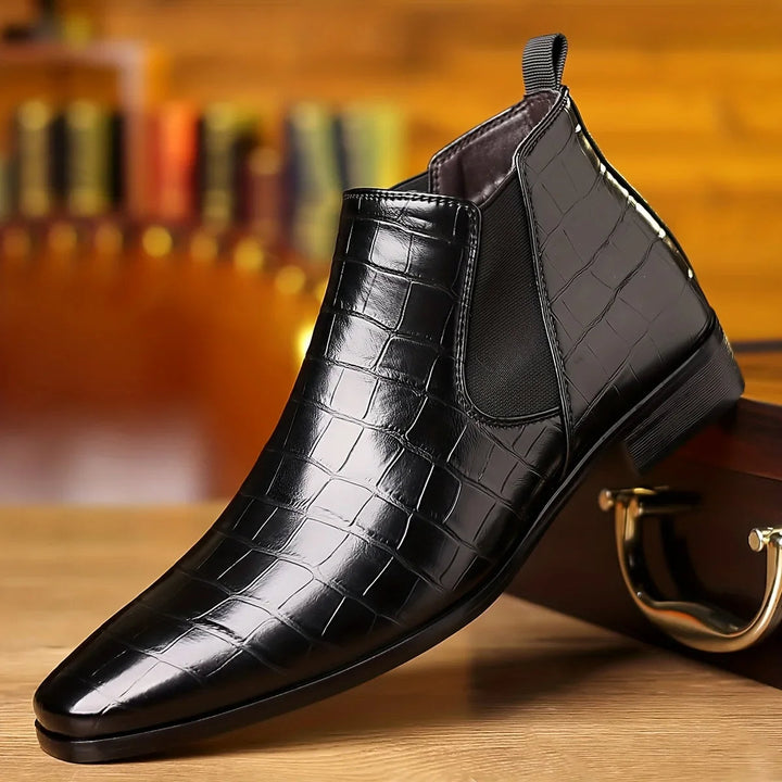 Full view of men's pointed toe crocodile embossed Chelsea boots, showcasing sleek design & craftsmanship.