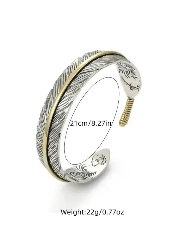 Elegant men's feather cuff bracelet, an adjustable stainless steel accessory for a sophisticated modern look.