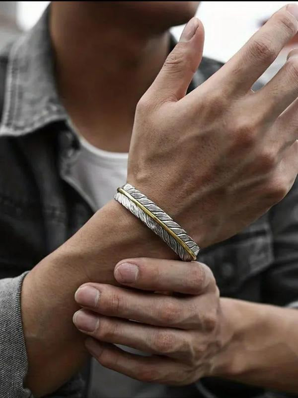 Stylish men's feather cuff bracelet. Adjustable, modern mixed metal design in silver & gold stainless steel jewelry.