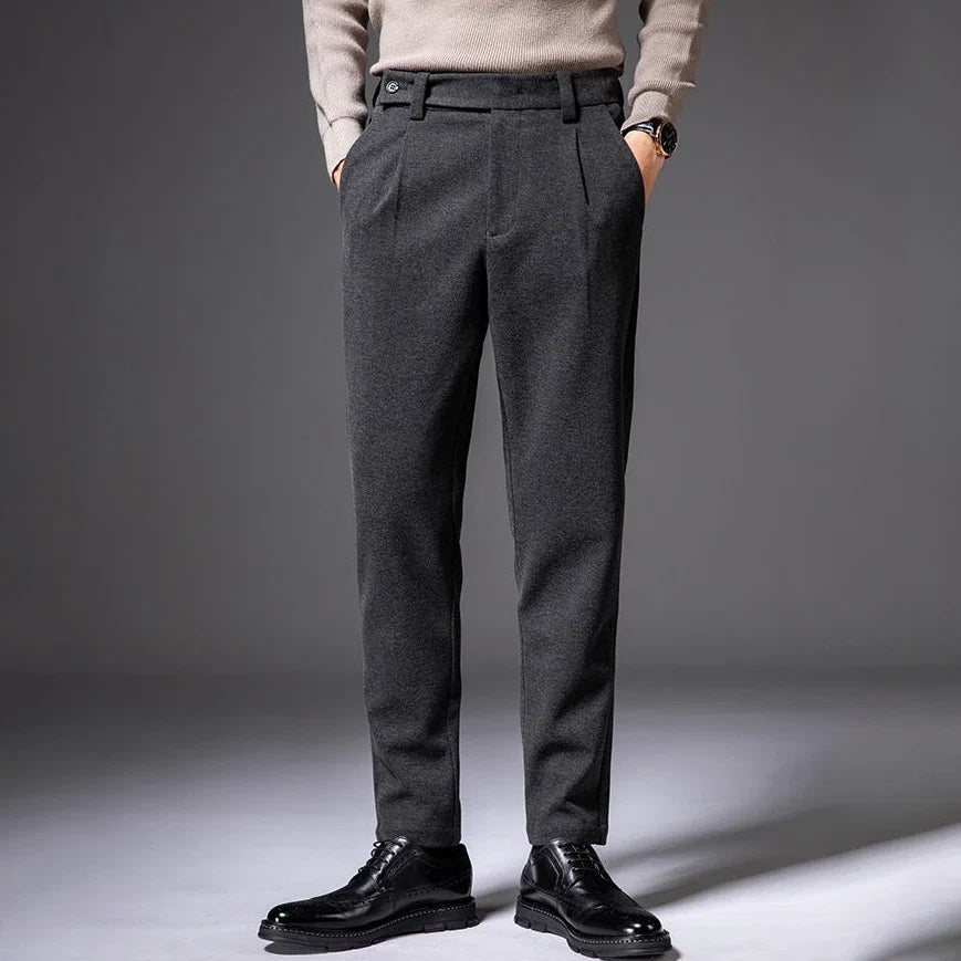 Wrinkle-resistant men's pleated dress trousers, offering all-day comfort & sophisticated style.