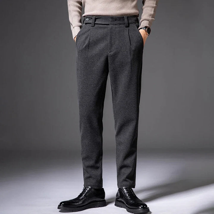 Wrinkle-resistant men's pleated dress trousers, offering all-day comfort & sophisticated style.