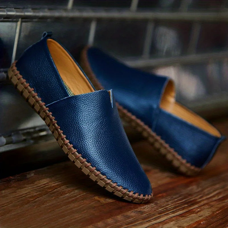 Classic men's dress loafers with a sleek slip-on design, offering comfort and style for any event.