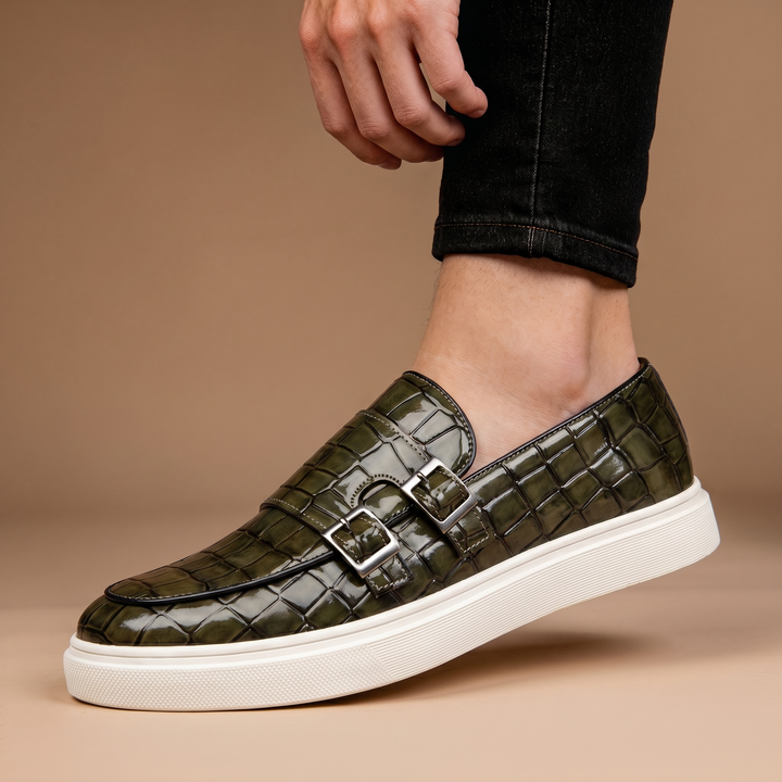 Classic men's slip-on loafers. Stylish buckle detail & cushioned comfort make these ideal dress or casual shoes.