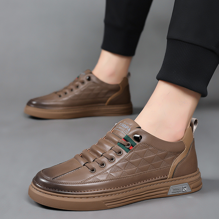 Fashionable men's sneakers featuring a unique geometric pattern, adding elegance to everyday style.