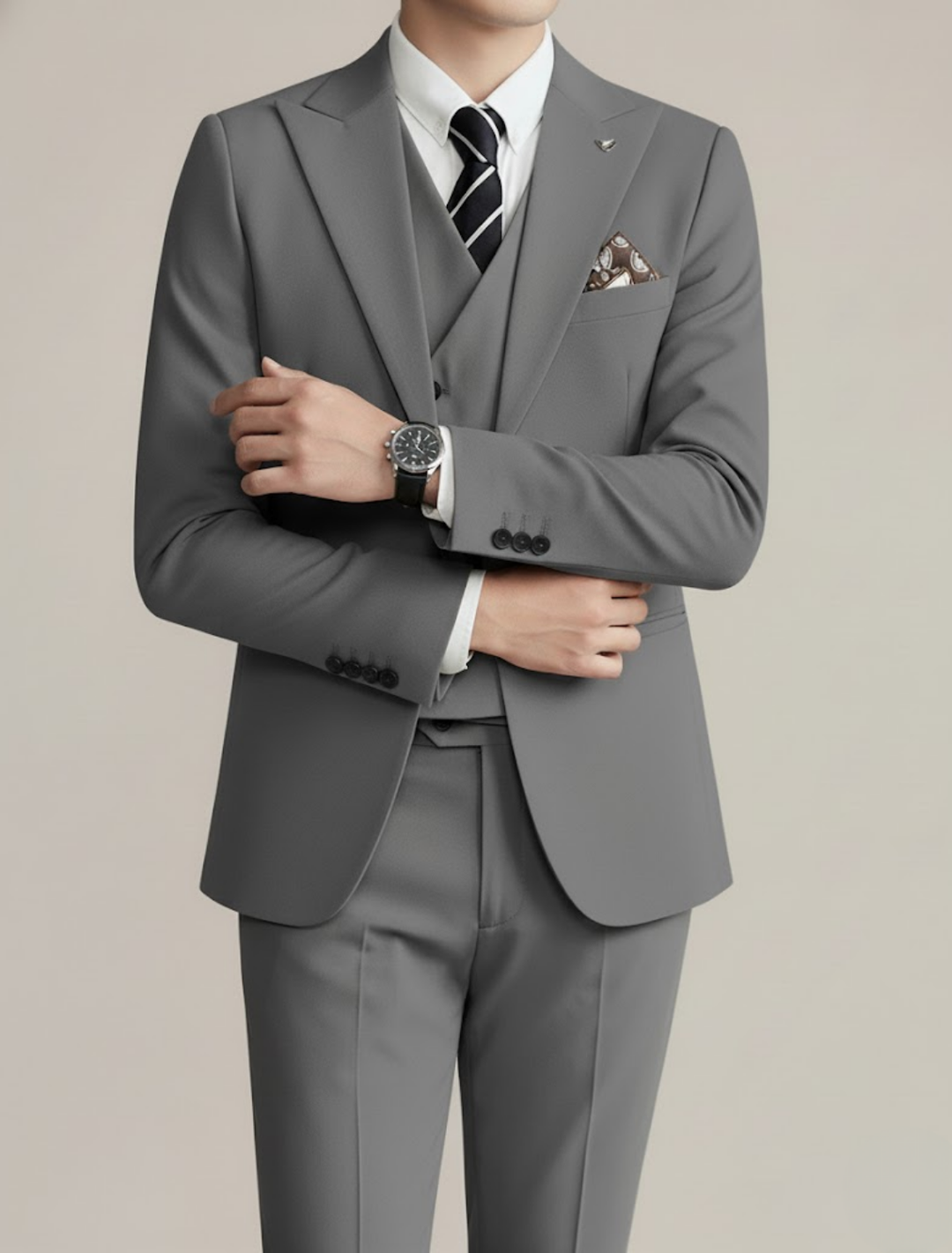 Man confidently posing in a sleek, elegant three-piece suit, ideal for formal occasions and men's fashion.