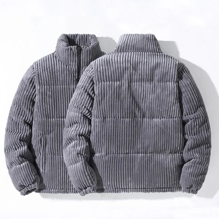 Close-up of the quilted detail on an elevated men's puffer jacket, showcasing texture.