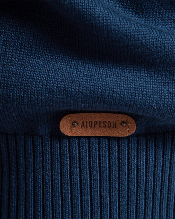 Up-close view of the intricate textured pattern on a men's versatile crew sweater.