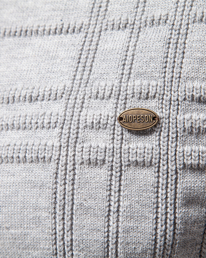 Versatile men's crew sweater with a soft textured knit in a light beige color.