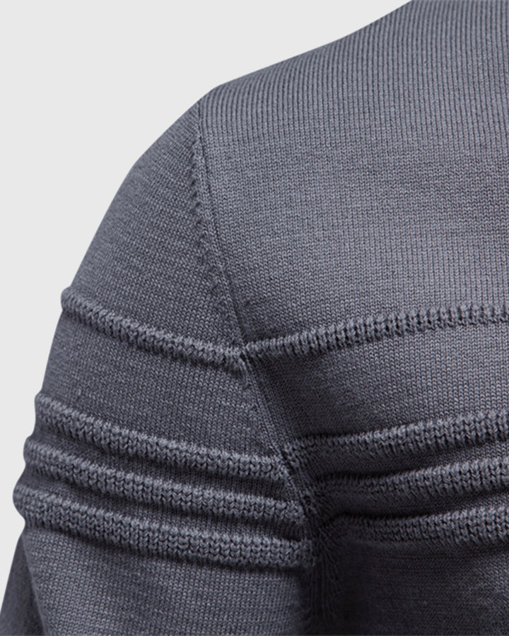 Detail shot of the subtle textured knit on a men's comfortable crewneck pullover.