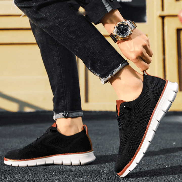 Elias men's minimalist sneakers on white background, offering breathable comfort.