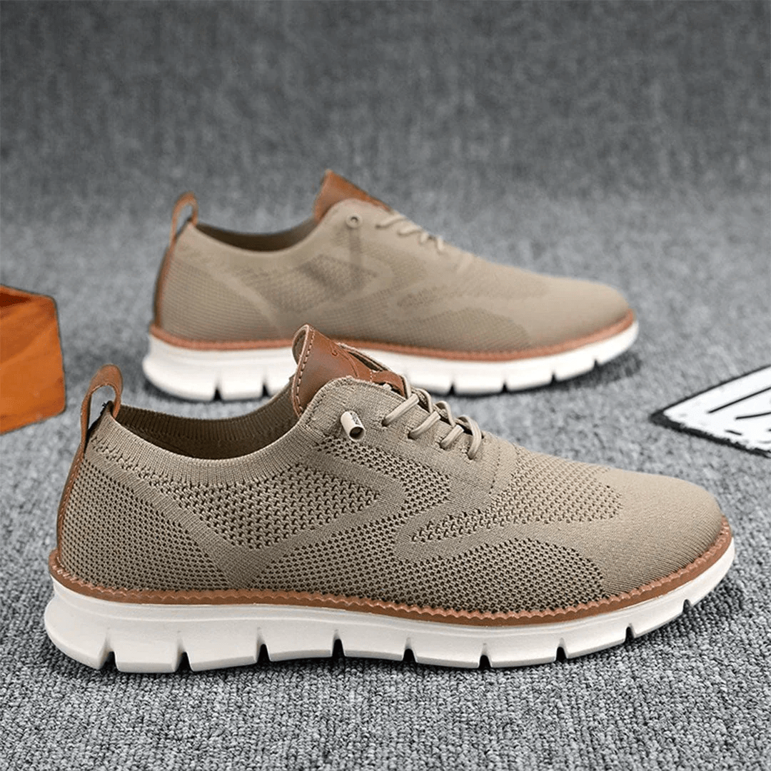Man walking in city wearing Elias minimalist breathable sneakers, casual style.