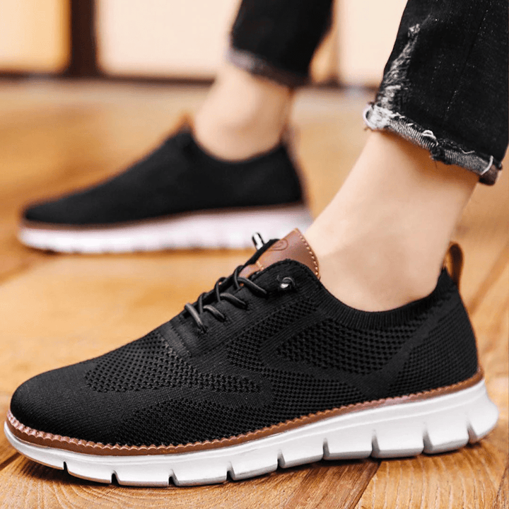 Side view of Elias breathable men's sneakers, sleek minimalist design.