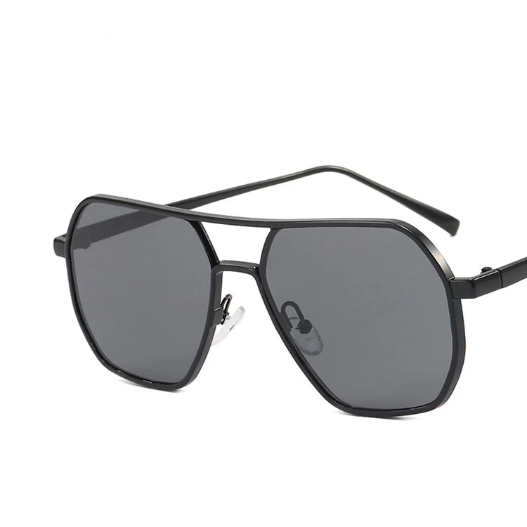 Close-up of men's modern aviator sunglasses, highlighting the sleek steel frame and UV400 protective lenses.
