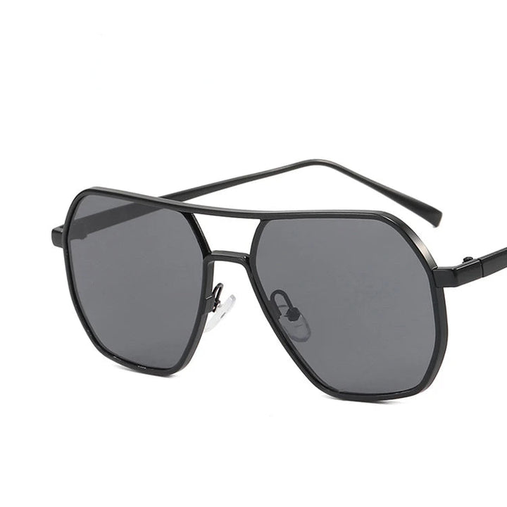 Close-up of men's modern aviator sunglasses, highlighting the sleek steel frame and UV400 protective lenses.