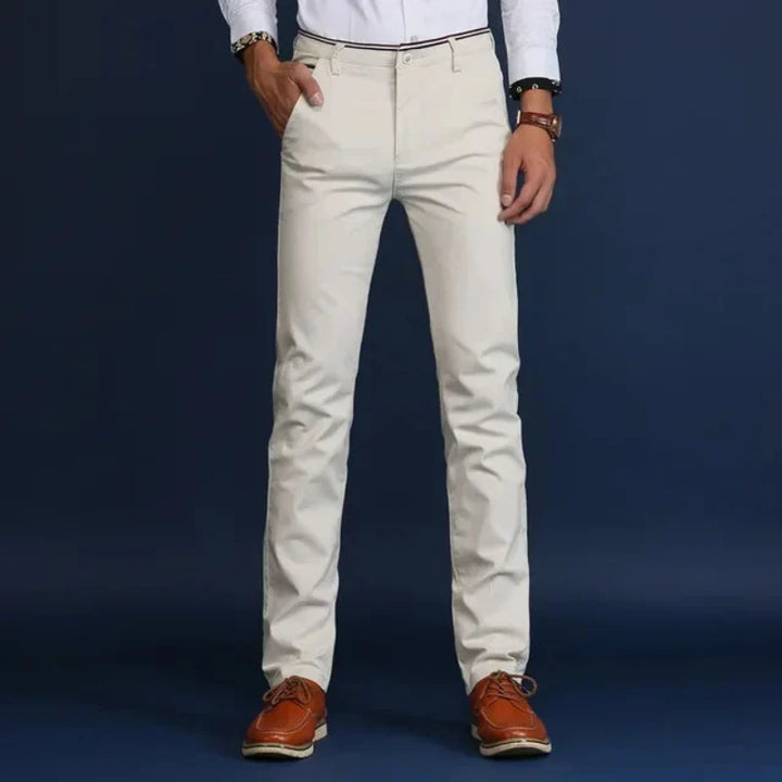 Men's Elite slim fit black dress pants. Tailored for comfort & professional workwear. Wrinkle-resistant stretch fabric.