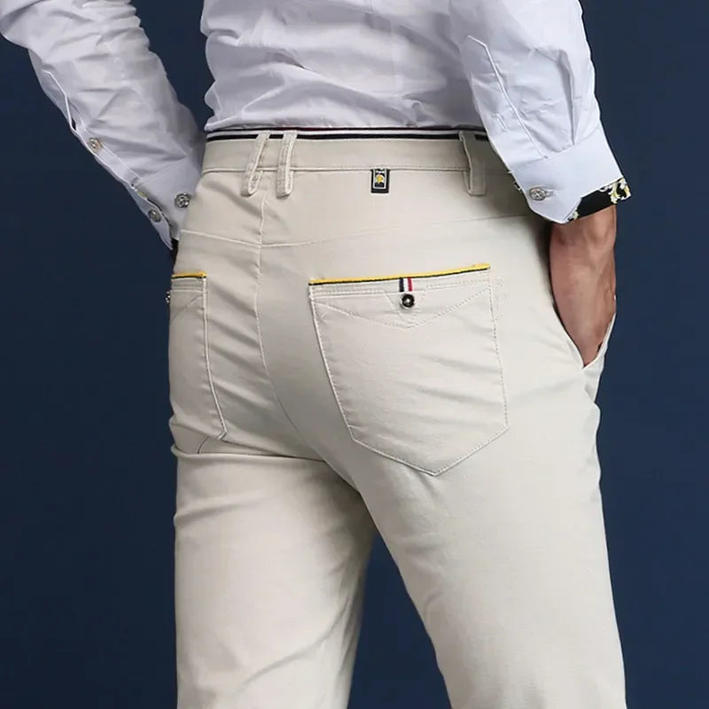 Khaki men's slim fit dress pants. Comfortable tailored design, perfect for smart casual or office wear.
