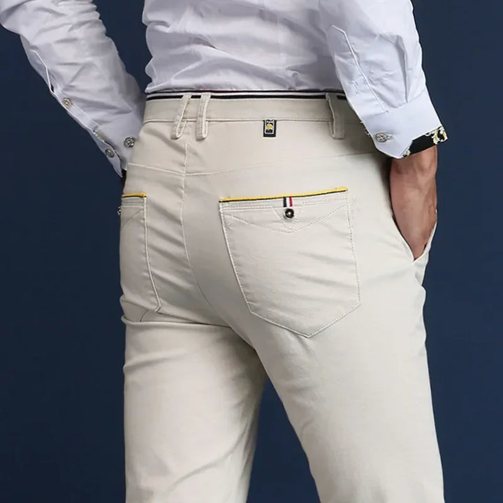Khaki men's slim fit dress pants. Comfortable tailored design, perfect for smart casual or office wear.