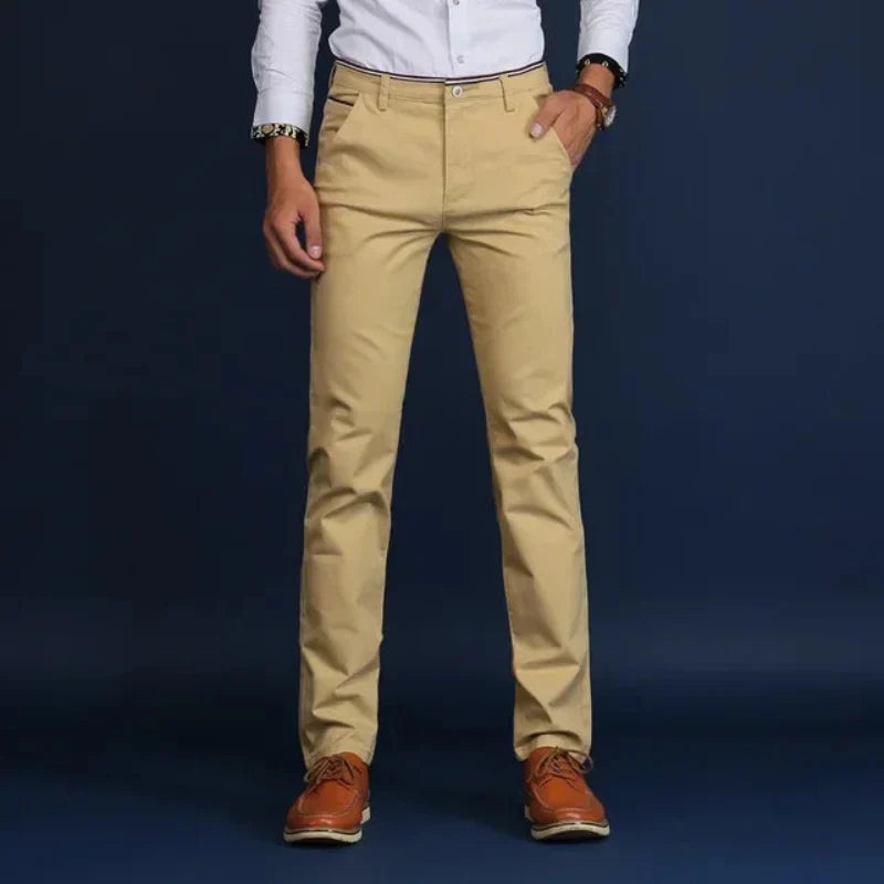 Light blue men's tailored slim fit dress pants. Stretch fabric for comfort & professional formal attire.