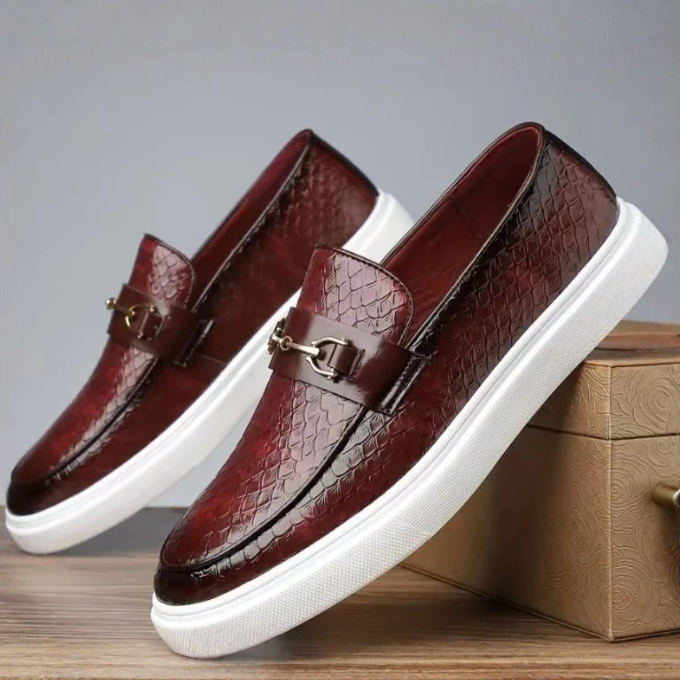 Unique men's embossed snakeskin pattern loafers, making a bold fashion statement with a stylish gold buckle.