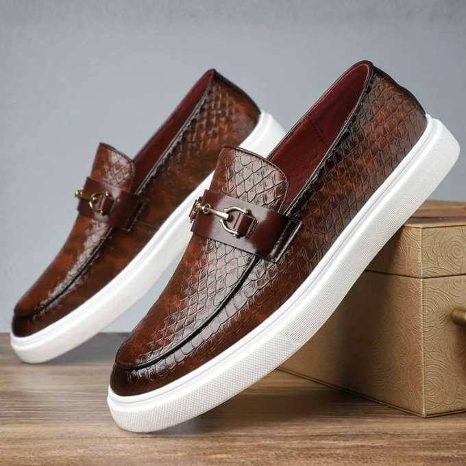 Men's fashion statement loafers: unique embossed snakeskin pattern, eye-catching gold buckle, versatile style.