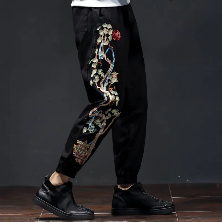 Obsidian men's embroidered joggers, blending urban fashion with a unique bonsai design for comfort.